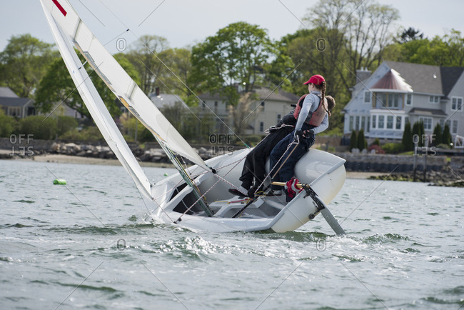 Junior sailors practicing in ocean