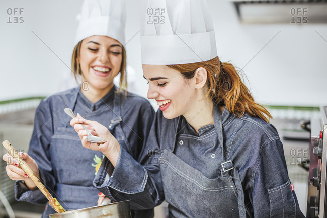 Junior chefs tasting chocolate sauce