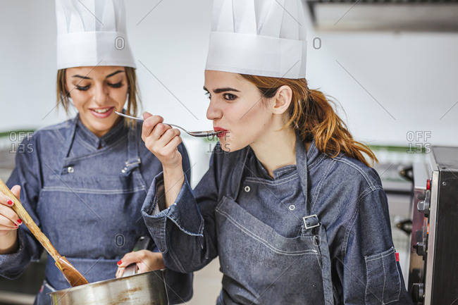 Junior chefs tasting chocolate sauce