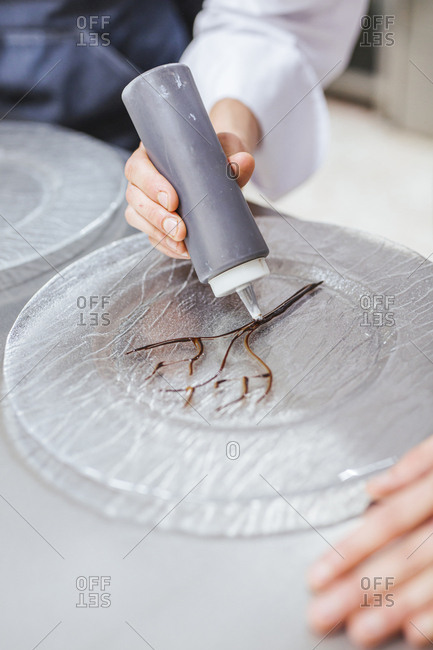 Junior chef preparing a dessert plate