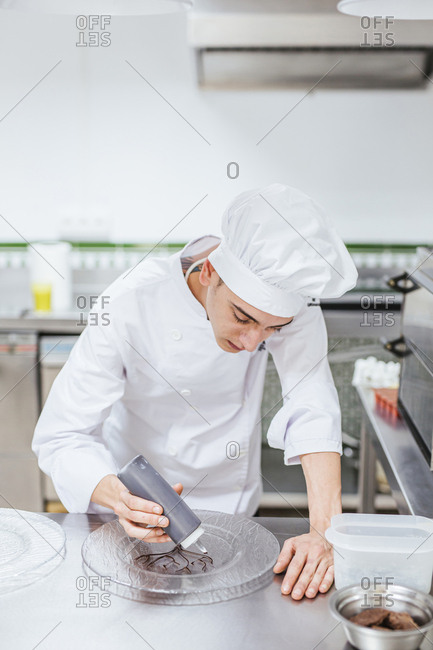 Junior chef preparing a dessert plate