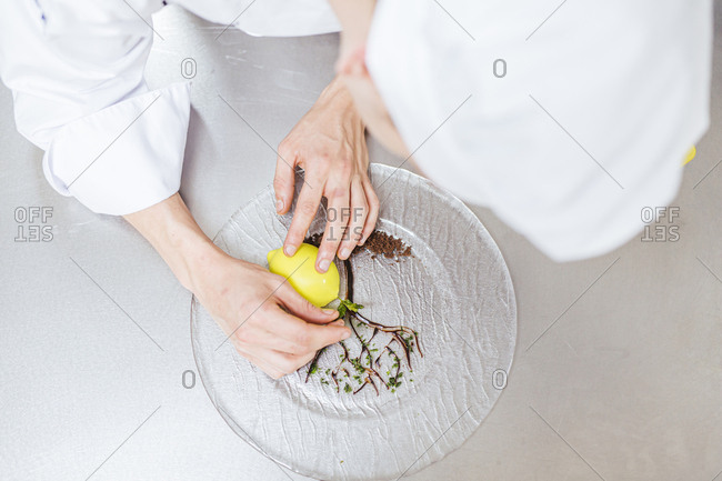 Junior chef preparing a dessert plate