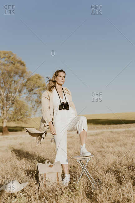 Female traveller with binoculars
