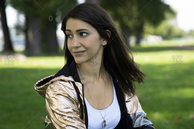Portrait of young woman wearing shiny jacket