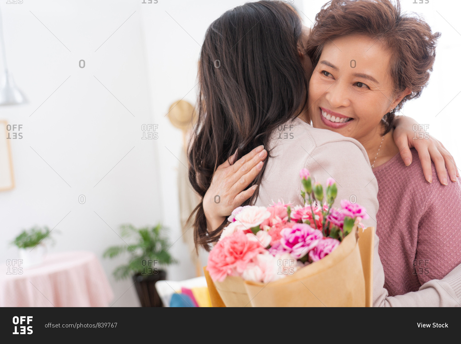 Mother and daughter hugs