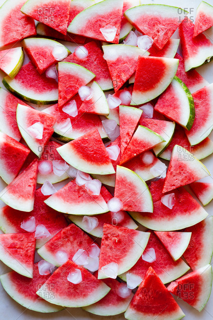 Watermelon slices kept cold with ice cubes