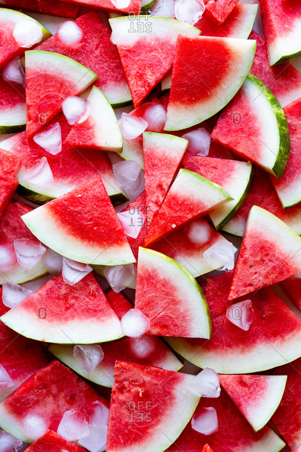 Close up of watermelon slices kept cold with ice cubes