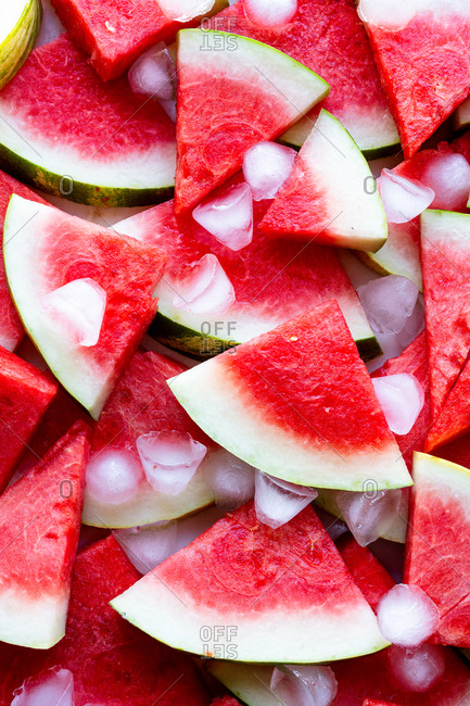 Close up of watermelon slices kept cold with ice cubes