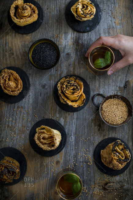 An assortment of sweet Tunisian rolls oudhnin el kadi served with tea