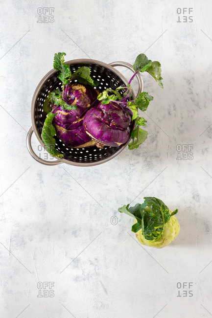 Kohlrabi cabbage on white background. Cooking healthy food concept