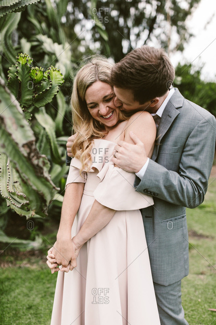 Man kissing his wife on the cheek