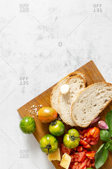 Ingredients for cooking Italian bruschetta with tomatoes