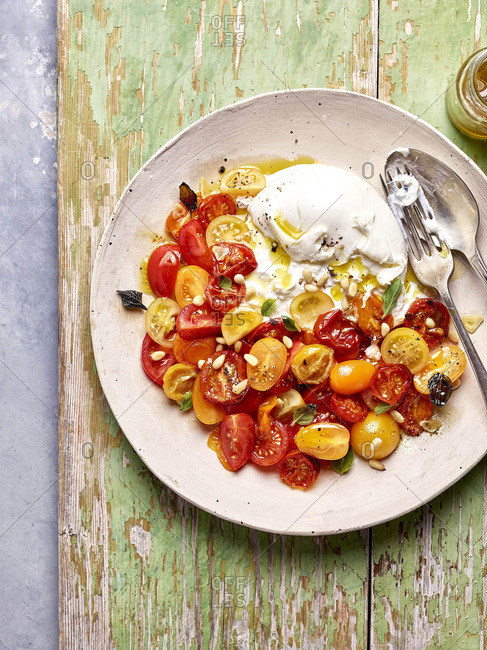 Buratta and tomato salad with sage, pine nuts and an olive oil dressing