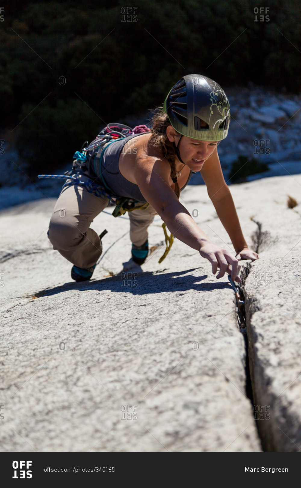 Woman climbing on mountain, Yosemite National Park, California stock