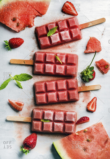 Strawberry watermelon ice cream popsicles with mint