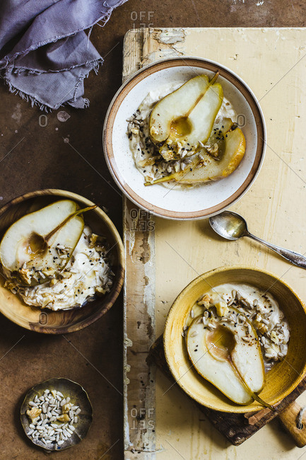 Roasted pears with mascarpone, honey, walnuts, sesame seeds and sunflowers seeds
