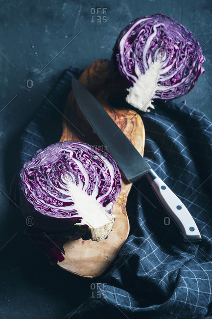 Halved red cabbage on dark background