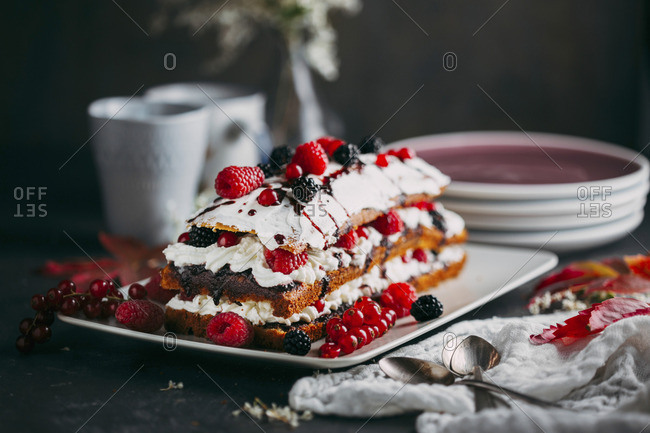 Tart with fresh berries on dark background