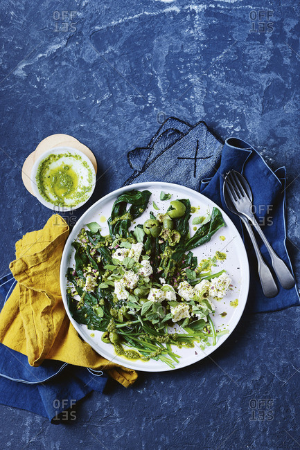 Spinach, olive and feta salad with oregano salsa verde