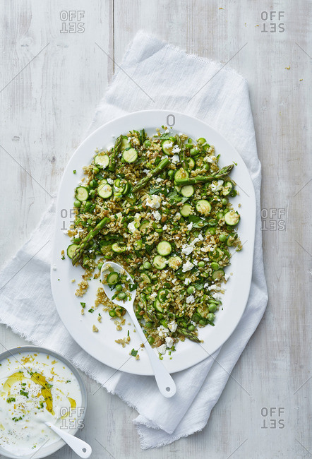 Mixed green meze with courgette garden peas asparagus mixed fresh herbs and topped with crumbled goats cheese