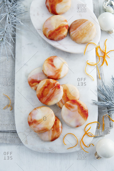 Orange biscuits with marbled orange icing