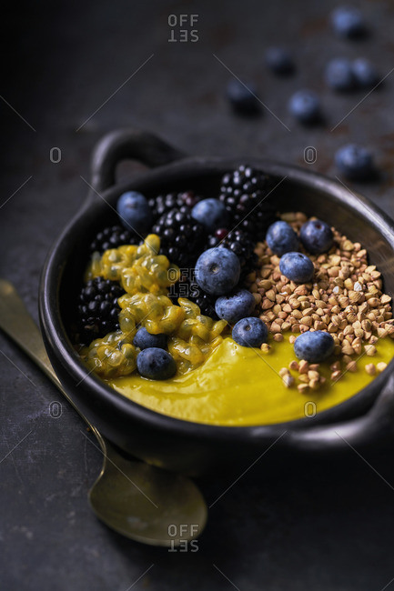 Breakfast bowl With mashed Avocado Mango, passion fruit, roasted buckwheat