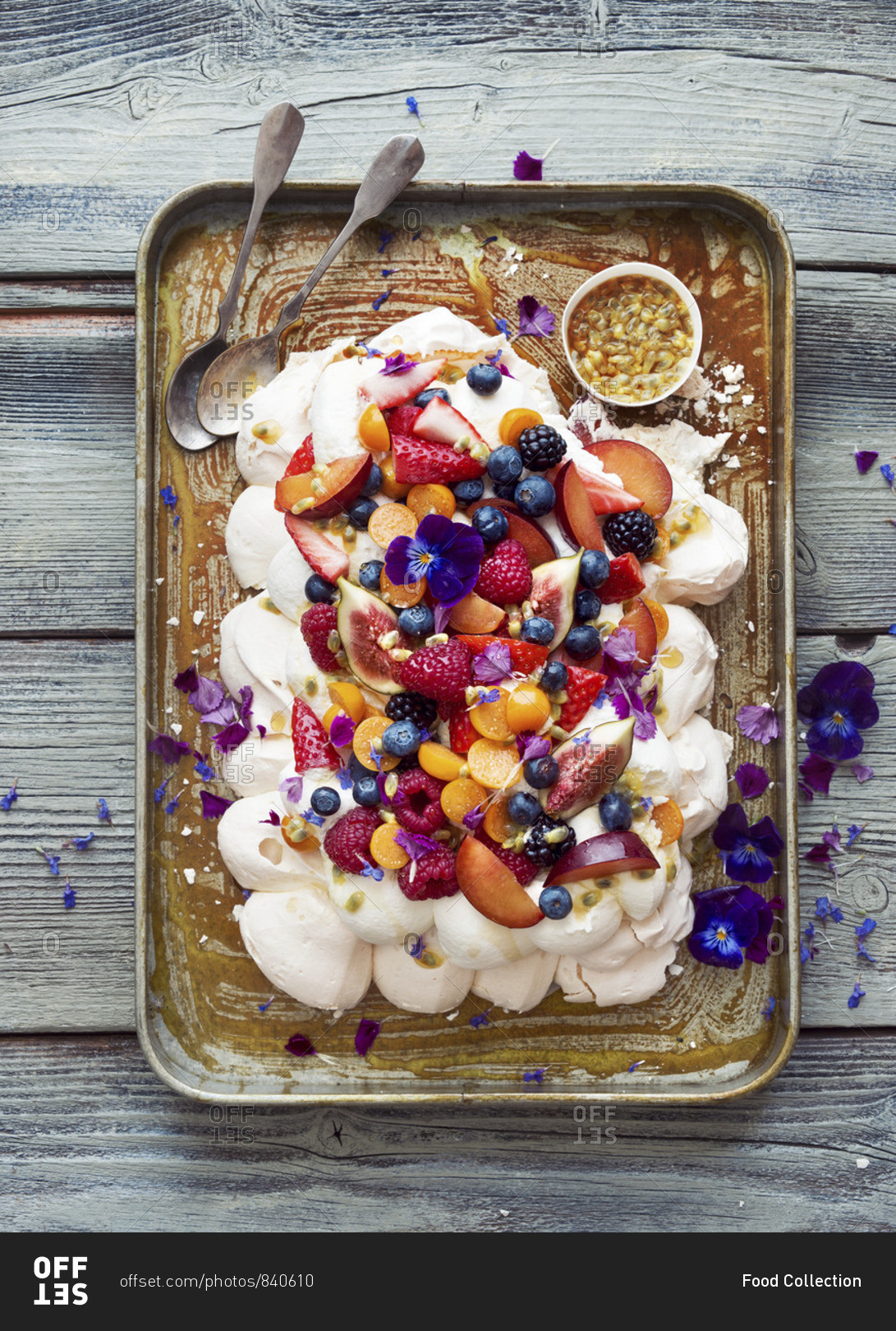 Pavlova with fruit, berries and a passion fruit topping