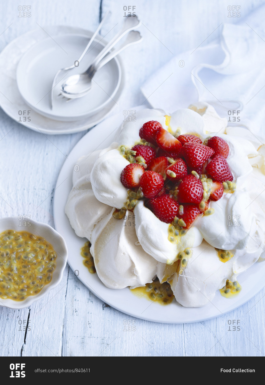 Pavlova with fresh strawberries and passion fruit