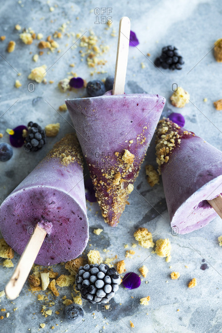 Homemade blueberry and blackberry ice cream on a stick