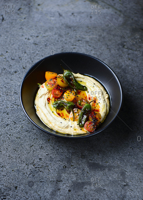 Hummus with chilli peppers and tomatoes