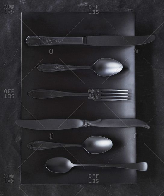 Vintage cutlery on a black surface