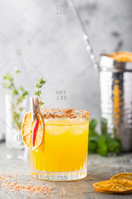 Refreshing summer citrus cocktail with orange, lemon juice and ice