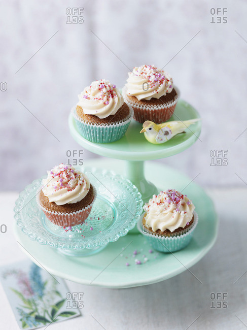 Cupcakes with buttercream and red sugar pearls