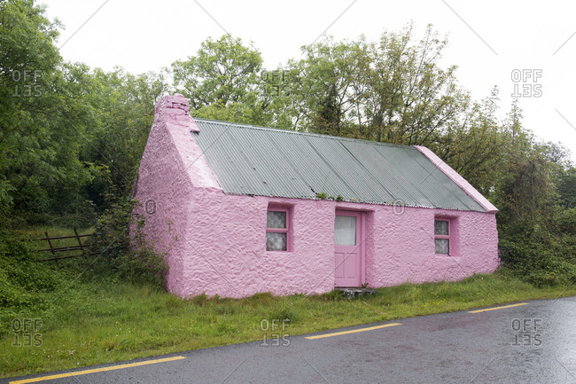 Old pink abandoned stone house, Tralee, Ireland