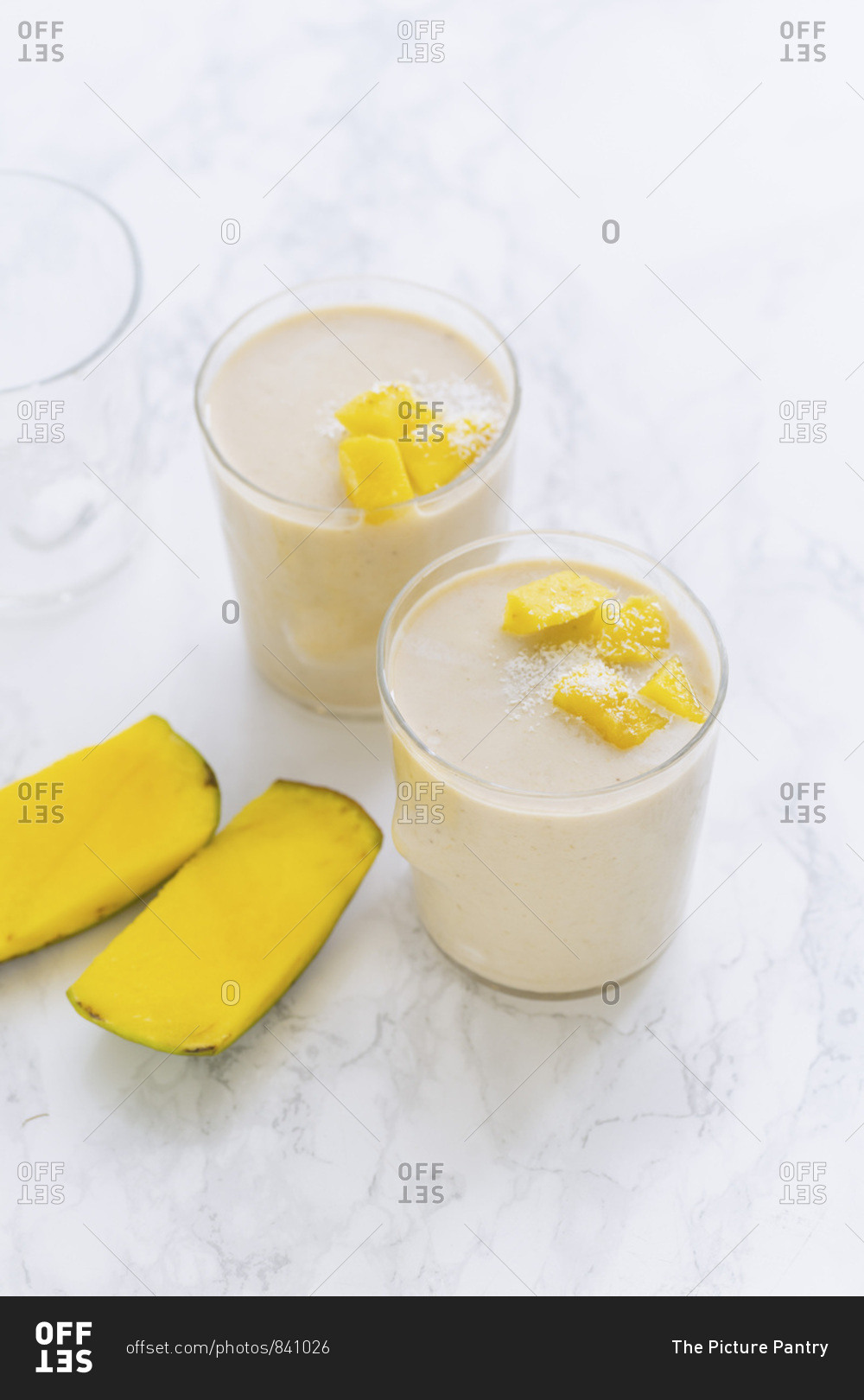 Mango banana smoothie with fresh mango and coconut