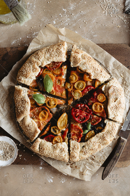 Delicious sliced tomato galette on a cutting board