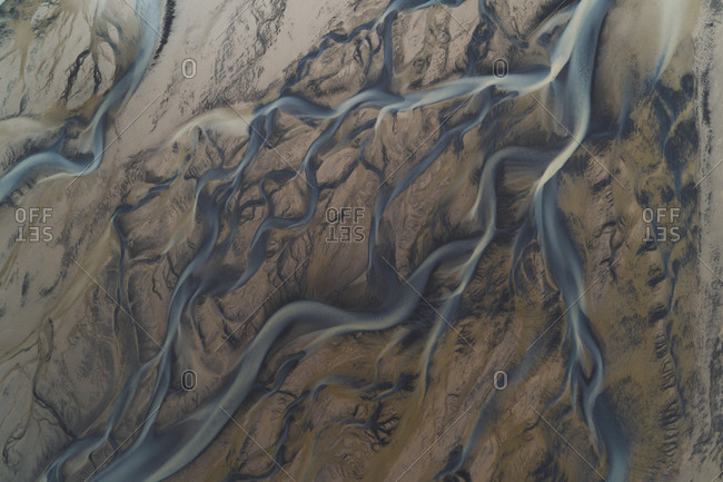 Braided rivers in Iceland, the color is from thousands of years of sediment moving from some of the many volcano's to the seas over the course of history.