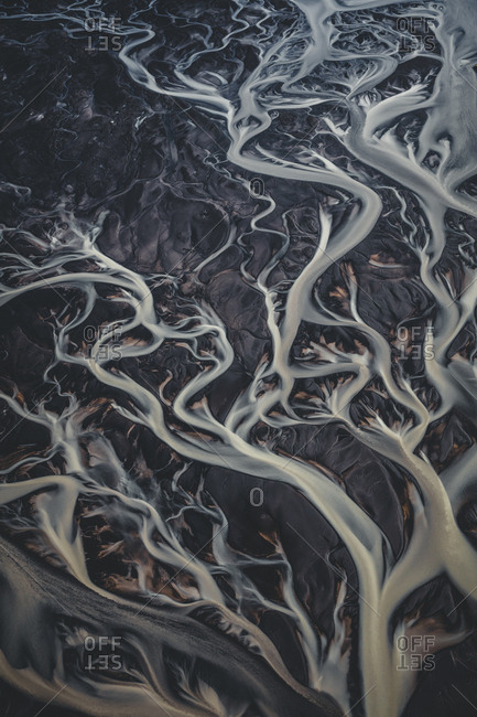 Braided rivers in Iceland, the color is from thousands of years of sediment moving from some of the many volcano's to the seas over the course of history.