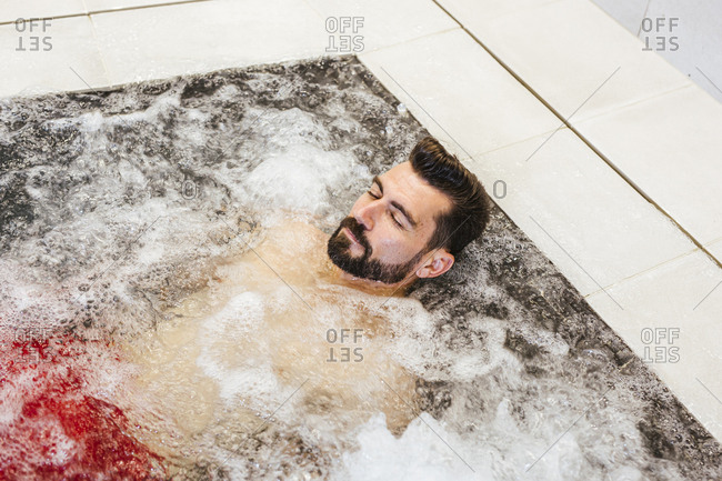 Man enjoying the whirlpool in a spa
