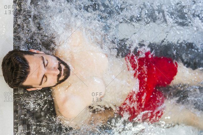 Man enjoying the whirlpool in a spa