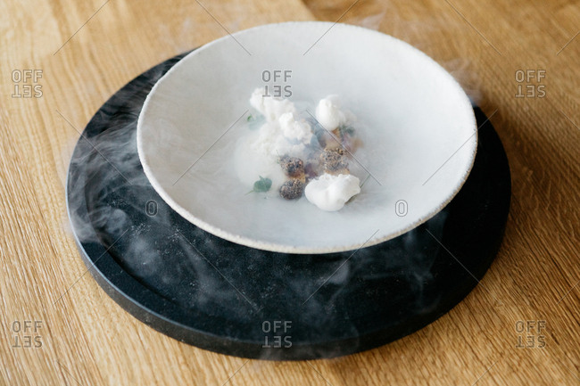 A smoking gourmet cheese appetizer