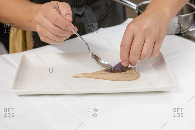 Chef preparing gourmet dish in restaurant