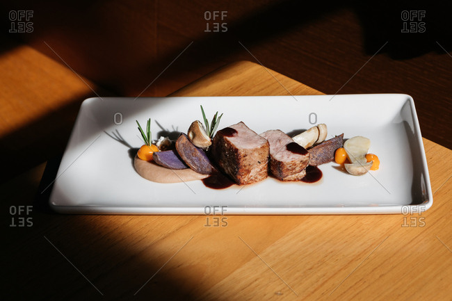 A gourmet meat and mushroom dish in restaurant