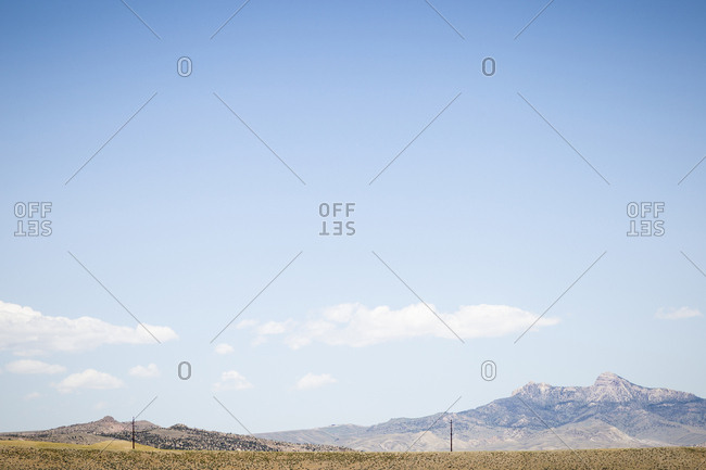 Scenic view of mountains against sky during sunny day