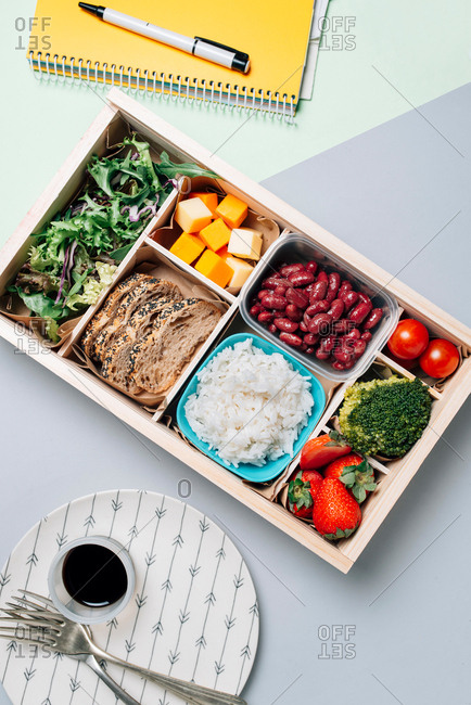 Food box with diet ingredients by copybook and plate