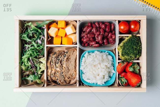 Food box with diet ingredients by copybook and plate