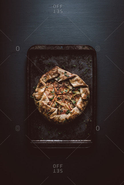 Fresh baked tomato galette on a baking sheet