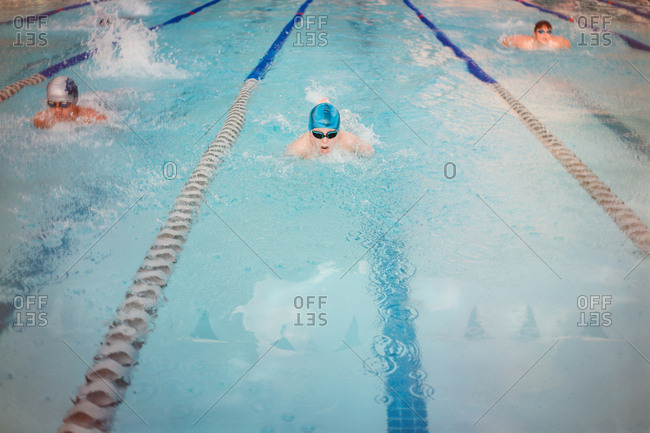 Tween boy swimming in a race
