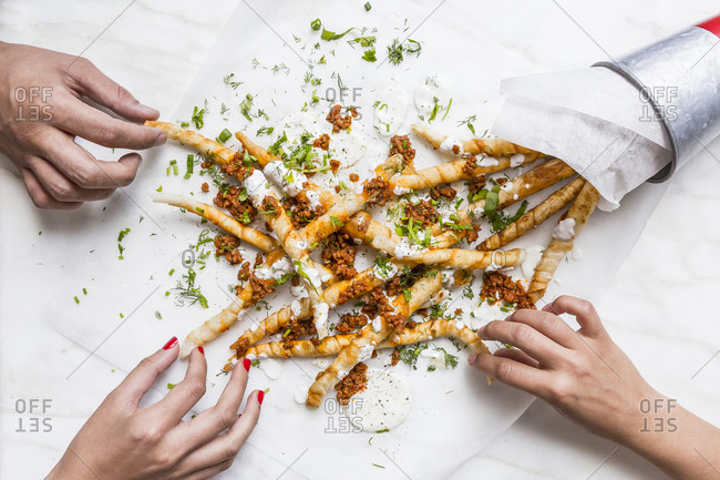 People sharing fried phyllo dough
