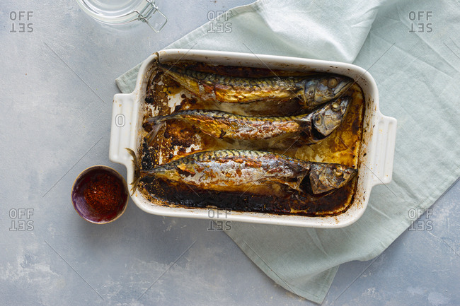 Freshly baked mackerel in a baking dish